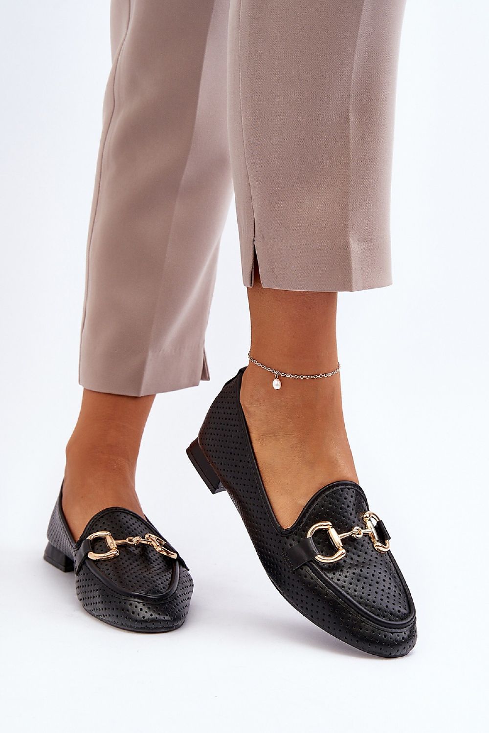 Close-up of luxury eco leather moccasin slip-ons with unique front ornament by Step in Style, showcasing the elegant design and comfort-focused insole.