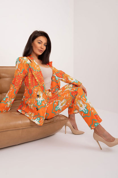 Detail of the high-quality fabric of the elegant women's 2-piece suit set by Italy Moda, showcasing the luxurious texture and unique print design.