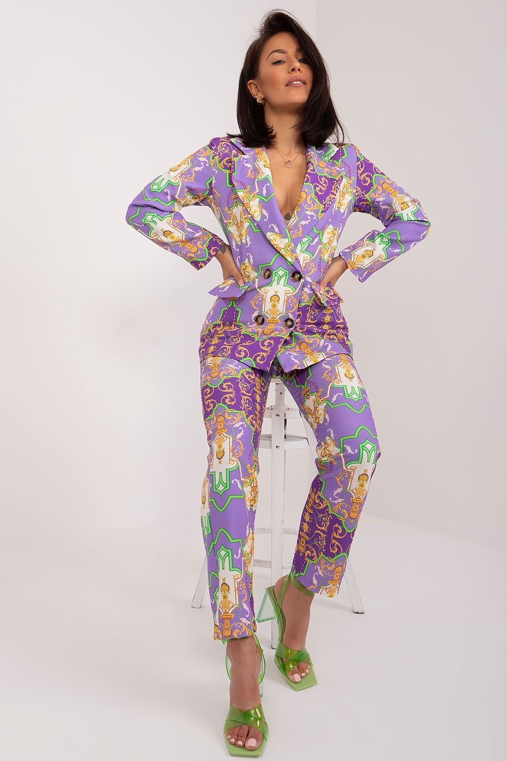 Elegant women's 2-piece suit set by Italy Moda, featuring a long-sleeved jacket with classic lapels and high waist straight-leg pants in a unique print, perfect for formal occasions and stylish everyday wear.