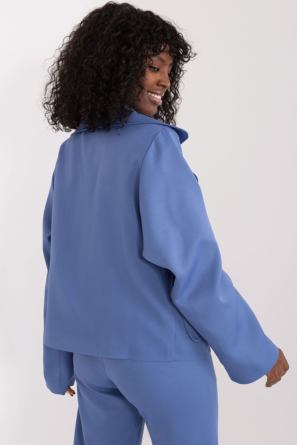 Lakerta's elegant long-sleeve blazer displayed with practical slip pockets, combining functionality with style.