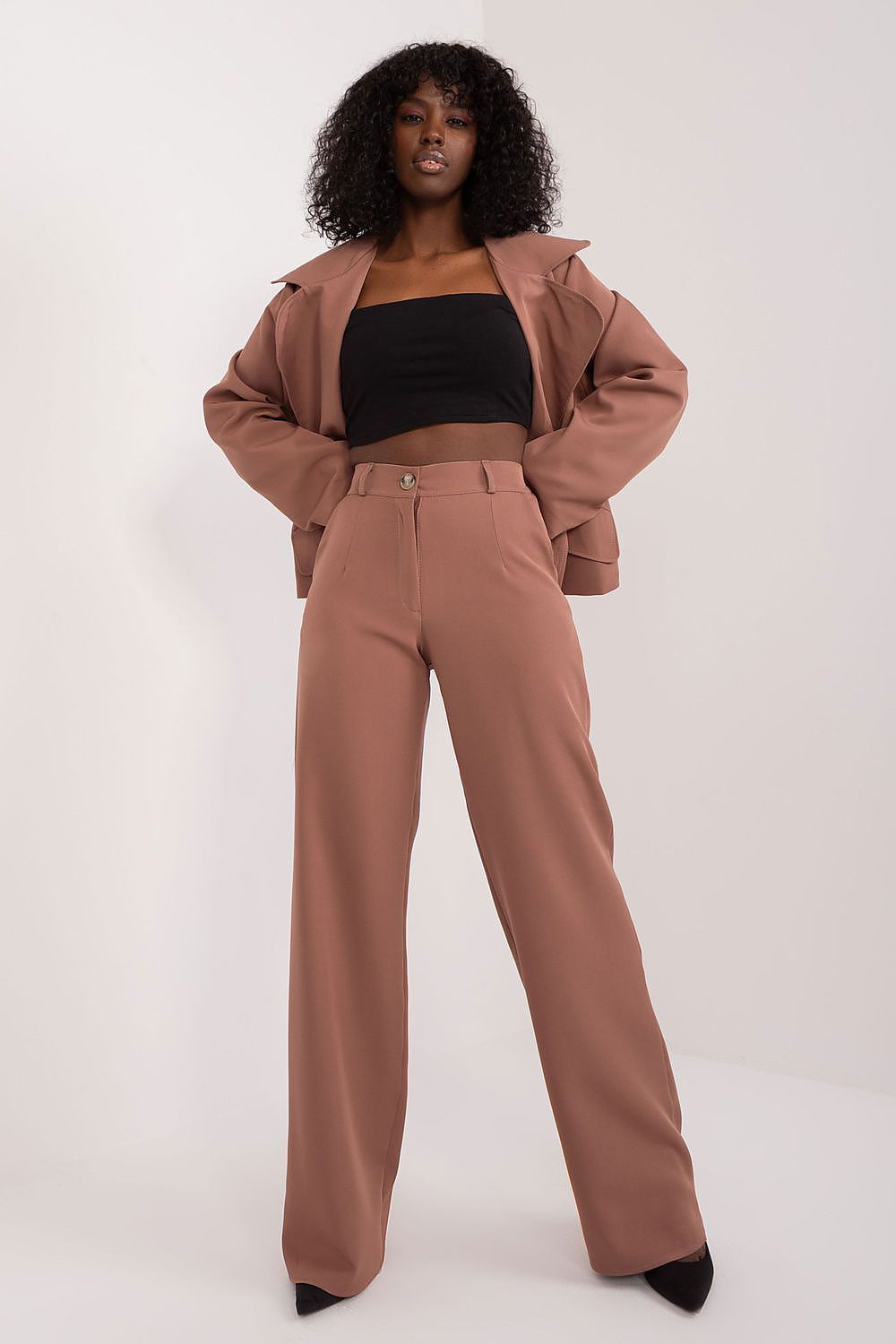 Luxurious Lakerta trousers featuring a smooth fabric pattern, straight legs, and high-quality workmanship for a refined appearance.