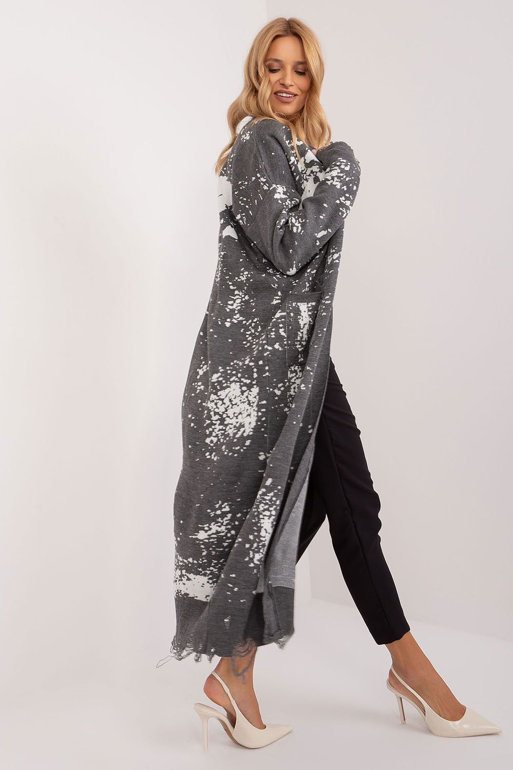 Elegant ankle-length Badu cardigan by Badu featuring a unique print and practical pockets, made from soft acrylic material.