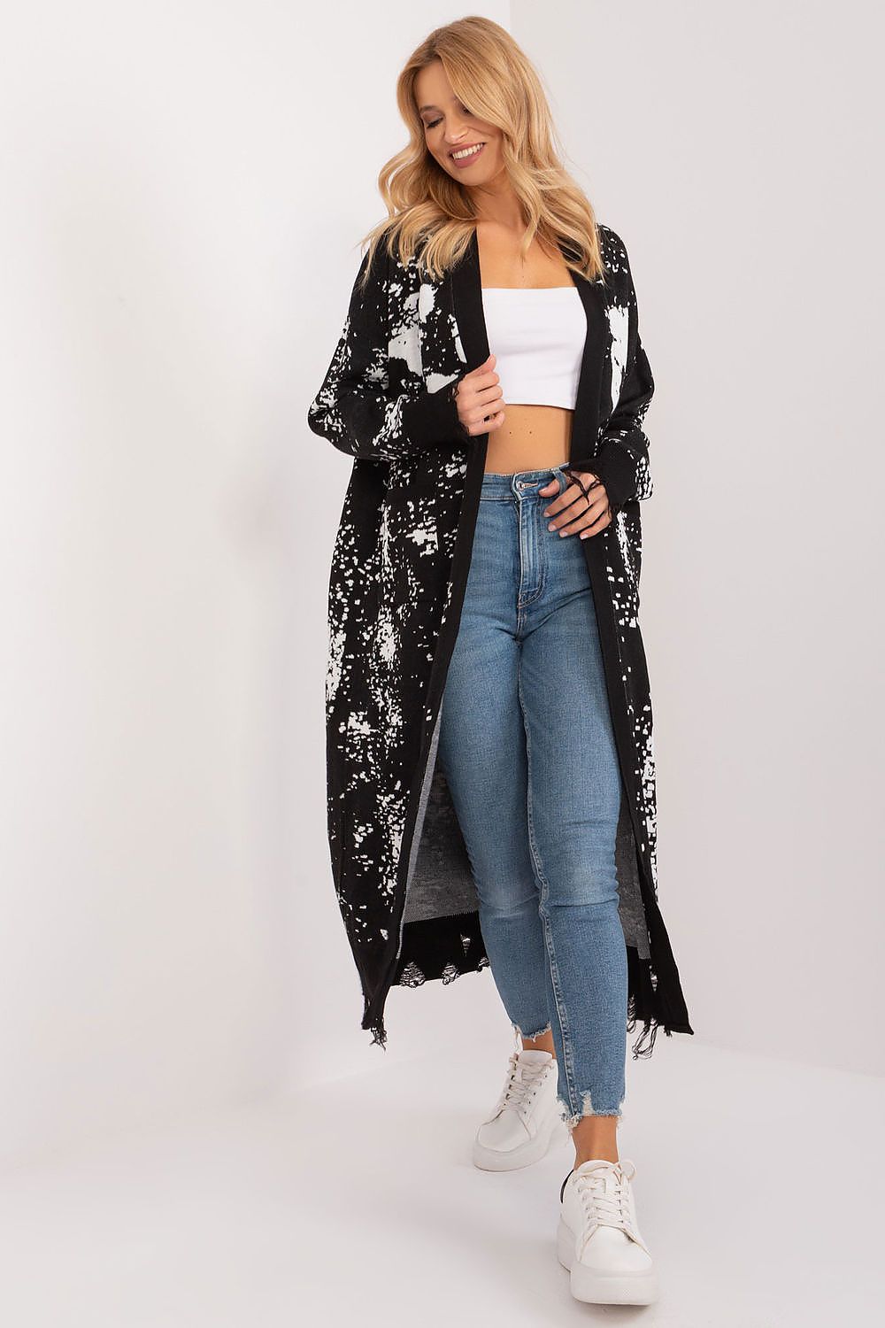 Badu cardigan elegantly draped on a model, highlighting its long sleeves and unique print, perfect for sophisticated styling.