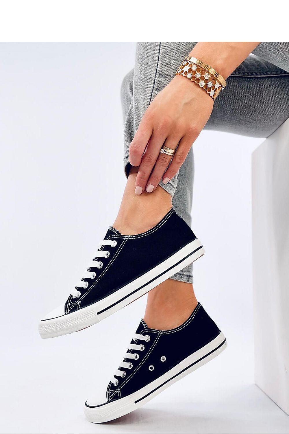 Stylish close-up of Inello's Classic Women's Lace-Up Sneakers showcasing fine fabric details.