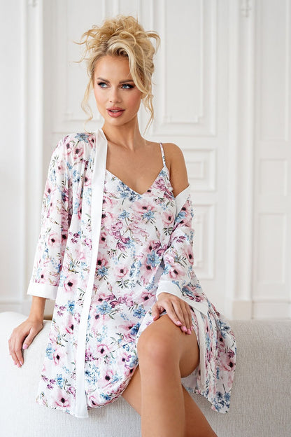 Close-up detail of the Rosa satin bathrobe by Donna showcasing the vibrant multicoloured floral pattern against shiny white satin.