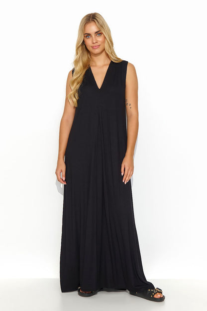 Chic Makadamia loose maxi dress showcasing slits and a gold plate detail at the back, designed for stylish summer outings.
