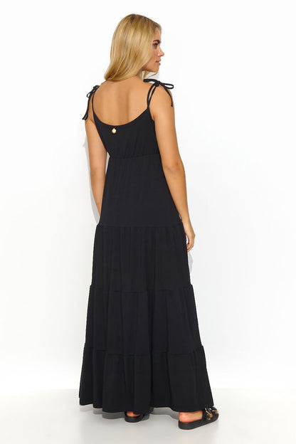 Full-length view of the stylish Makadamia summer dress in a flattering silhouette, perfect for warm weather occasions.
