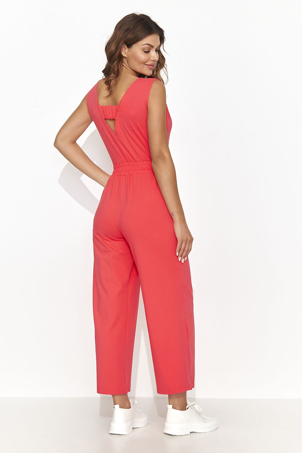 Trendy Numinou Women's Flared Leg Jumpsuit made from soft cotton-spandex blend, perfect for a luxurious summer vacation ensemble.
