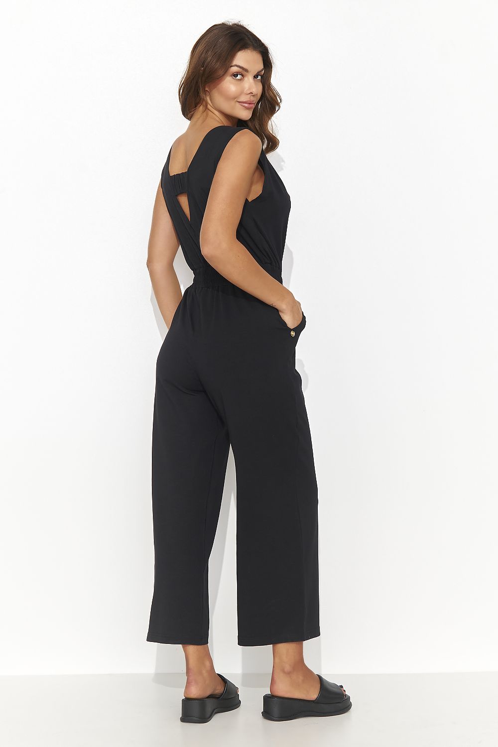 Elegant Numinou Women's Cotton Spandex Knit Jumpsuit with Drawstring Waist and Flared Legs, showcasing a flattering silhouette perfect for summer styling.