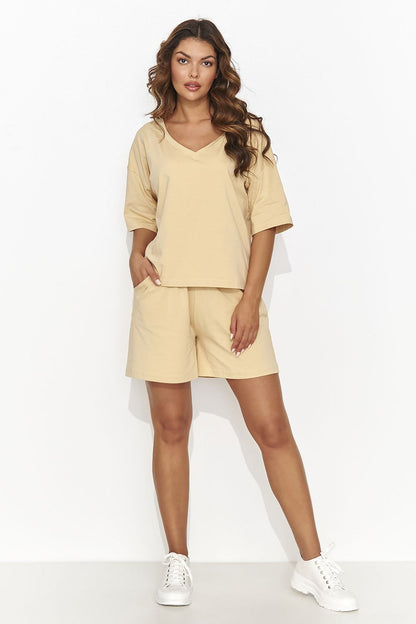 Chic Numinou Women's Set featuring a heart neckline blouse and relaxed-fit shorts, designed for contemporary comfort and luxury.