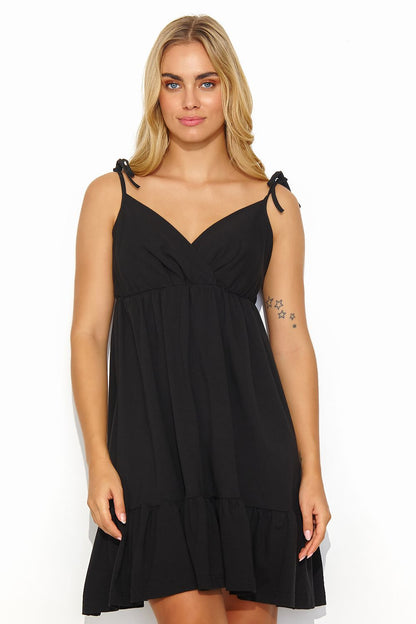 Ruffled hem detail of the stylish Makadamia summer dress, designed for comfort and elegance during warm days.