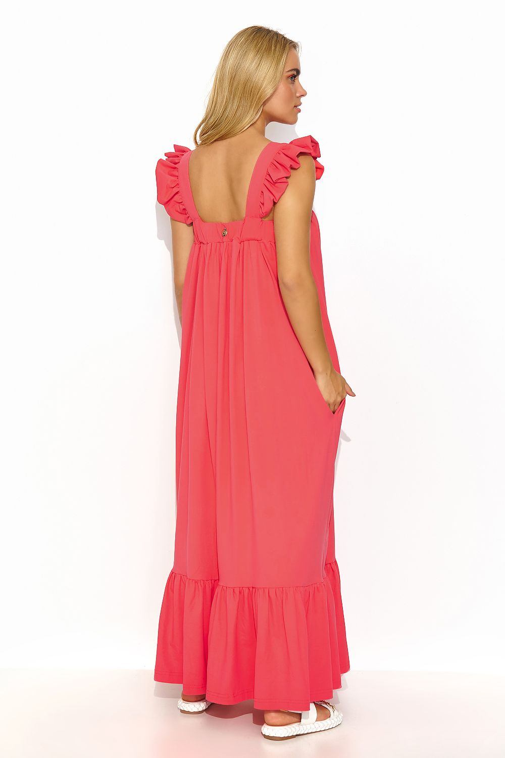 Model wearing the stylish Makadamia Summer Maxi Dress with ruffled shoulders, perfect for warm summer evenings.