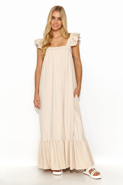 Stylish Makadamia Maxi Dress showcasing the graceful ruffles and convenient side pockets, ideal for casual gatherings.