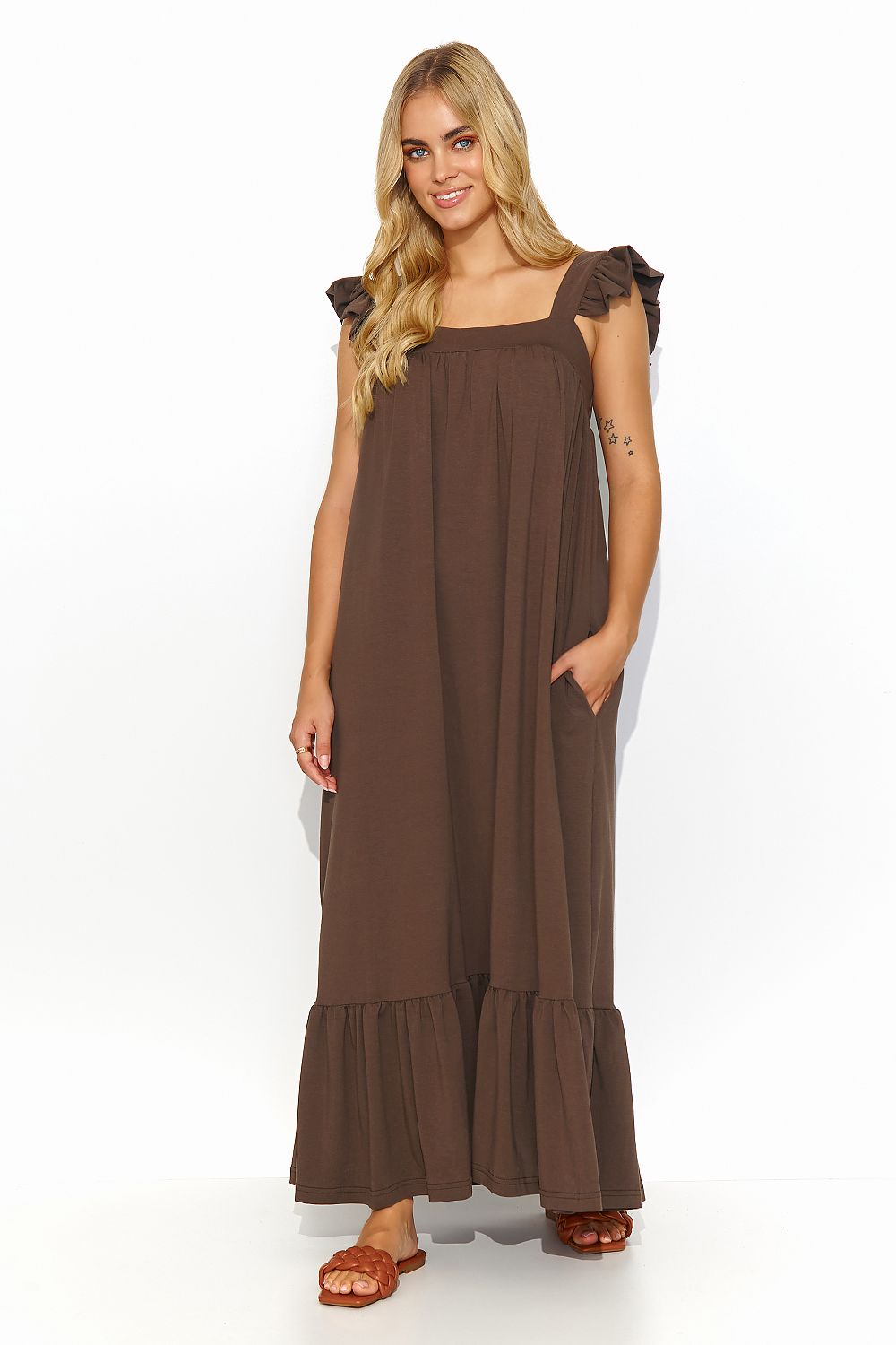 Breathable Makadamia Summer Dress with delicate ruffle details, perfect for a romantic sunset dinner.