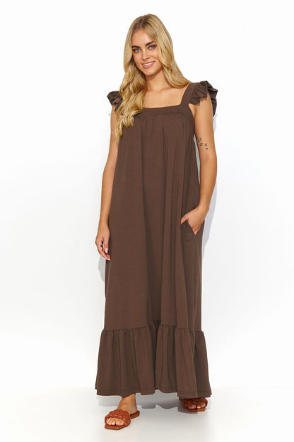 Breathable Makadamia Summer Dress with delicate ruffle details, perfect for a romantic sunset dinner.