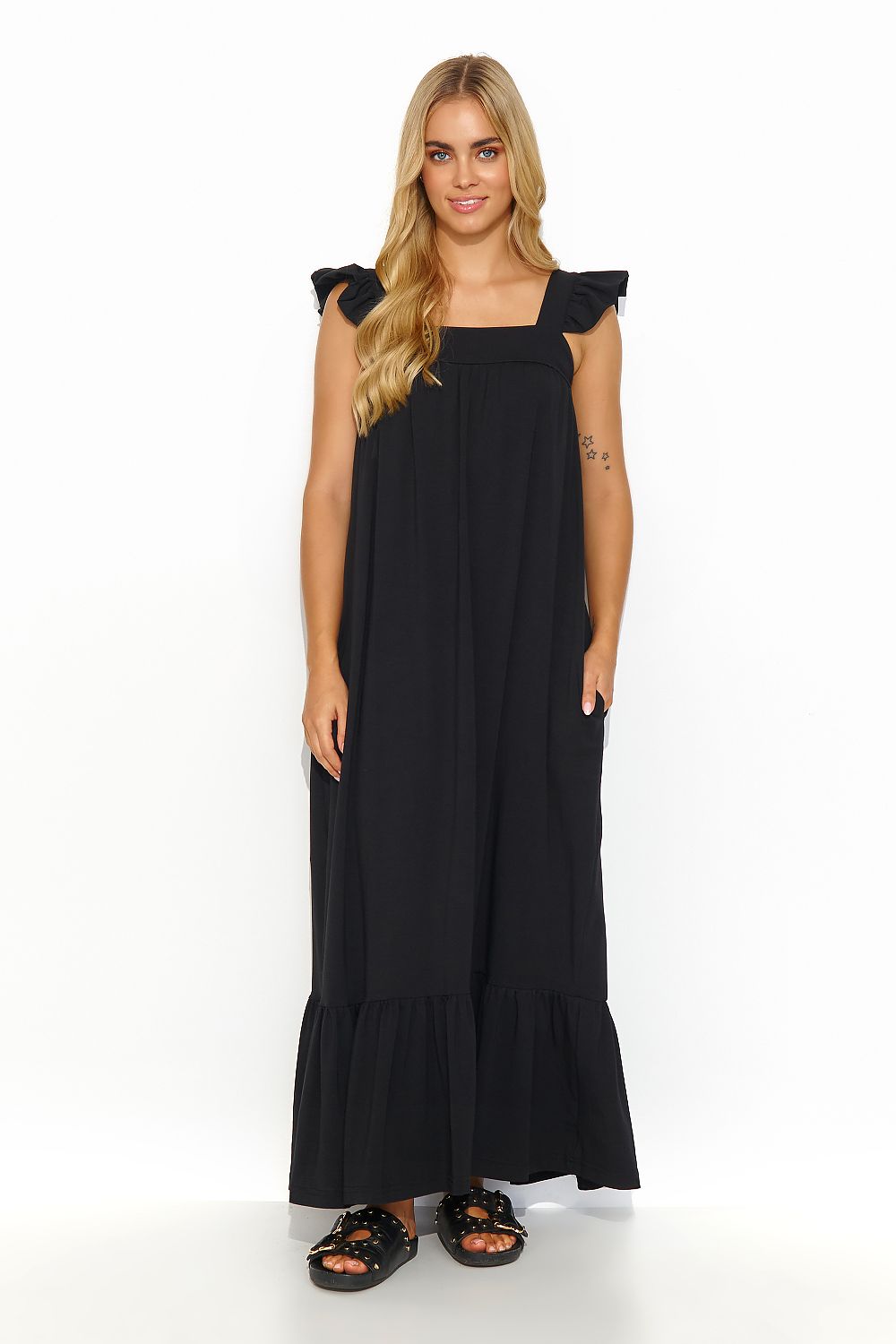 Makadamia luxury summer maxi dress with ruffled shoulders and practical side pockets, showcasing elegant design and comfort for various occasions.