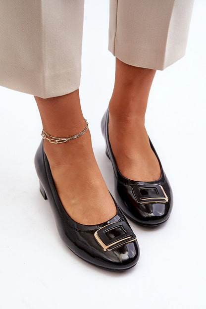 Sophisticated women's black pumps by Step in Style, made from eco leather, displaying an elegant buckle detail and comfortable block heel.