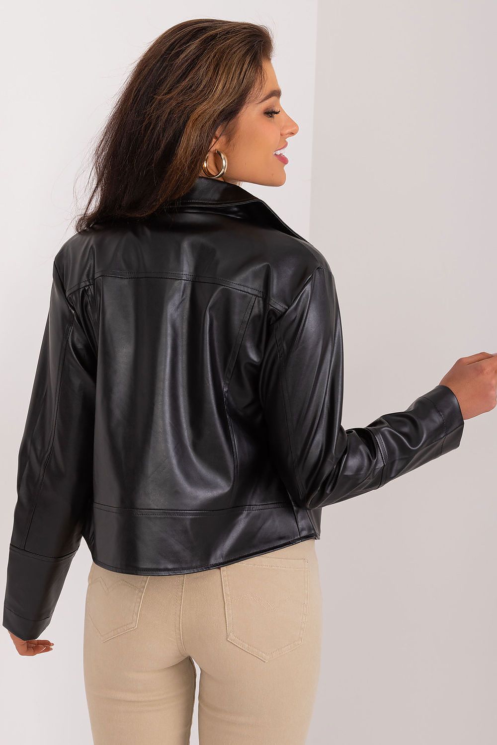 Close-up of Lakerta's eco-leather jacket showcasing high-quality polyester fabric, perfect for transitional weather and environmental consciousness.