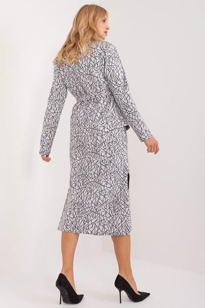 Stylish Lakerta midi dress with tie belt, highlighting the feminine silhouette and round neckline, designed for luxury and comfort.