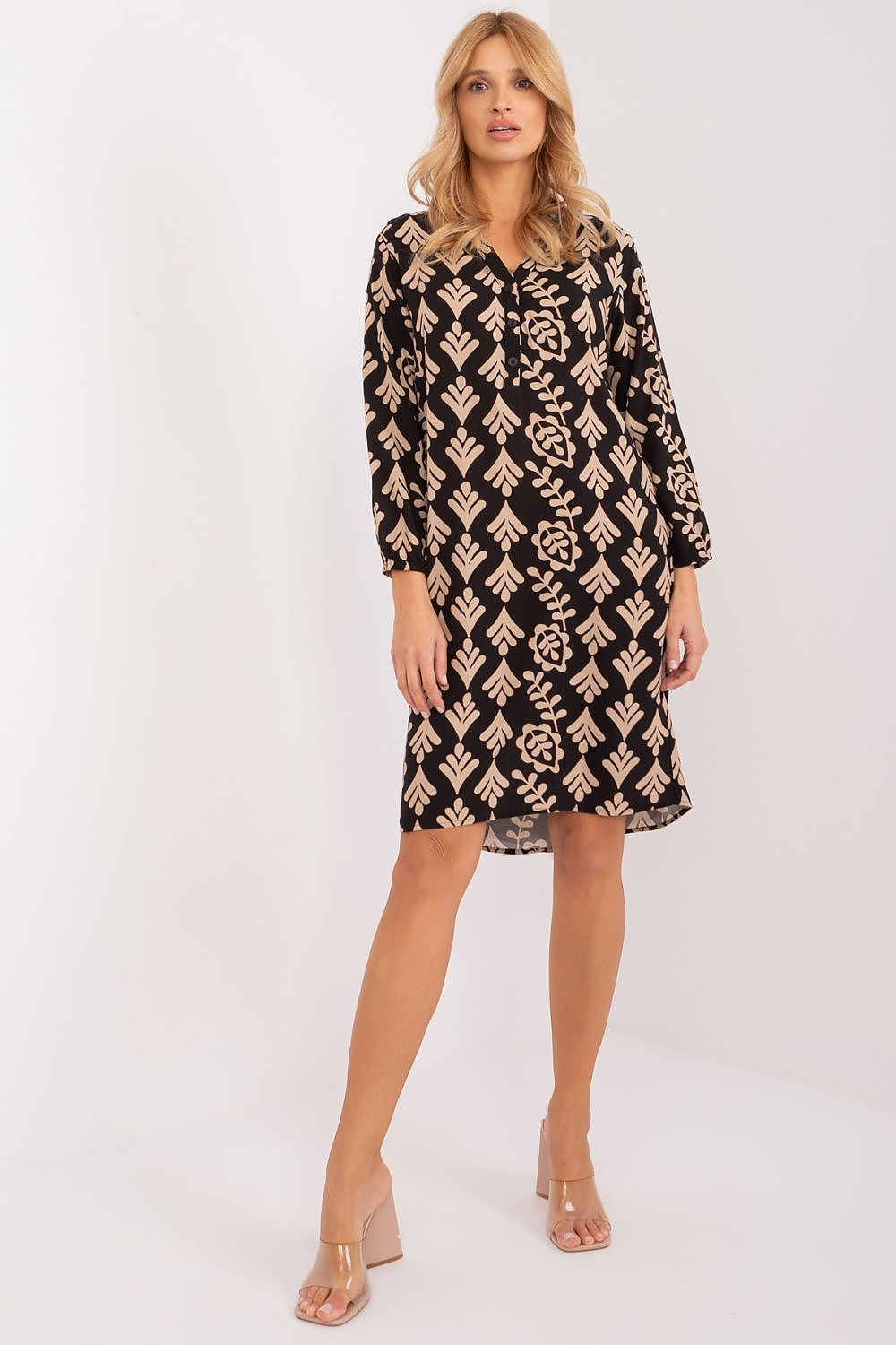 Detailed view of Sublevel's fashionable long sleeve dress, highlighting its trendy asymmetric styling and lightweight material for effortless summer elegance.