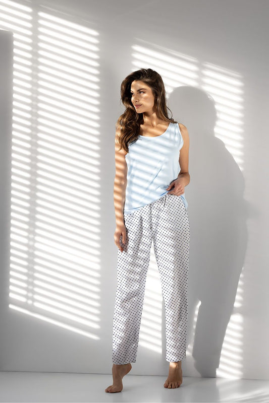 Luxurious women's 2-piece pajama set from Momenti Per Me, crafted from OEKO-TEX certified cotton for oversized comfort, featuring elegant design with a U-neck sleeveless blouse and stylish pants with pockets.