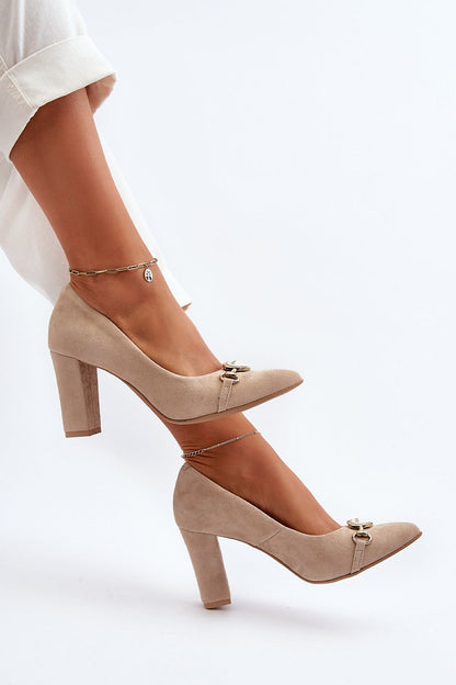 Luxury pointed toe natural leather pumps with a delicate heart ornament, perfect for any occasion by Step in Style.