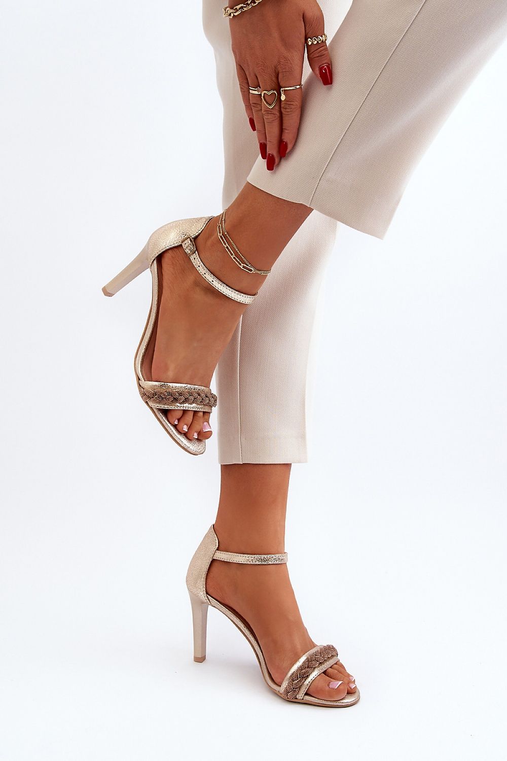 Full view of elegant women's stiletto sandals with an adjustable strap, crafted from natural leather and embellished with zirconias, offered by Step in Style.