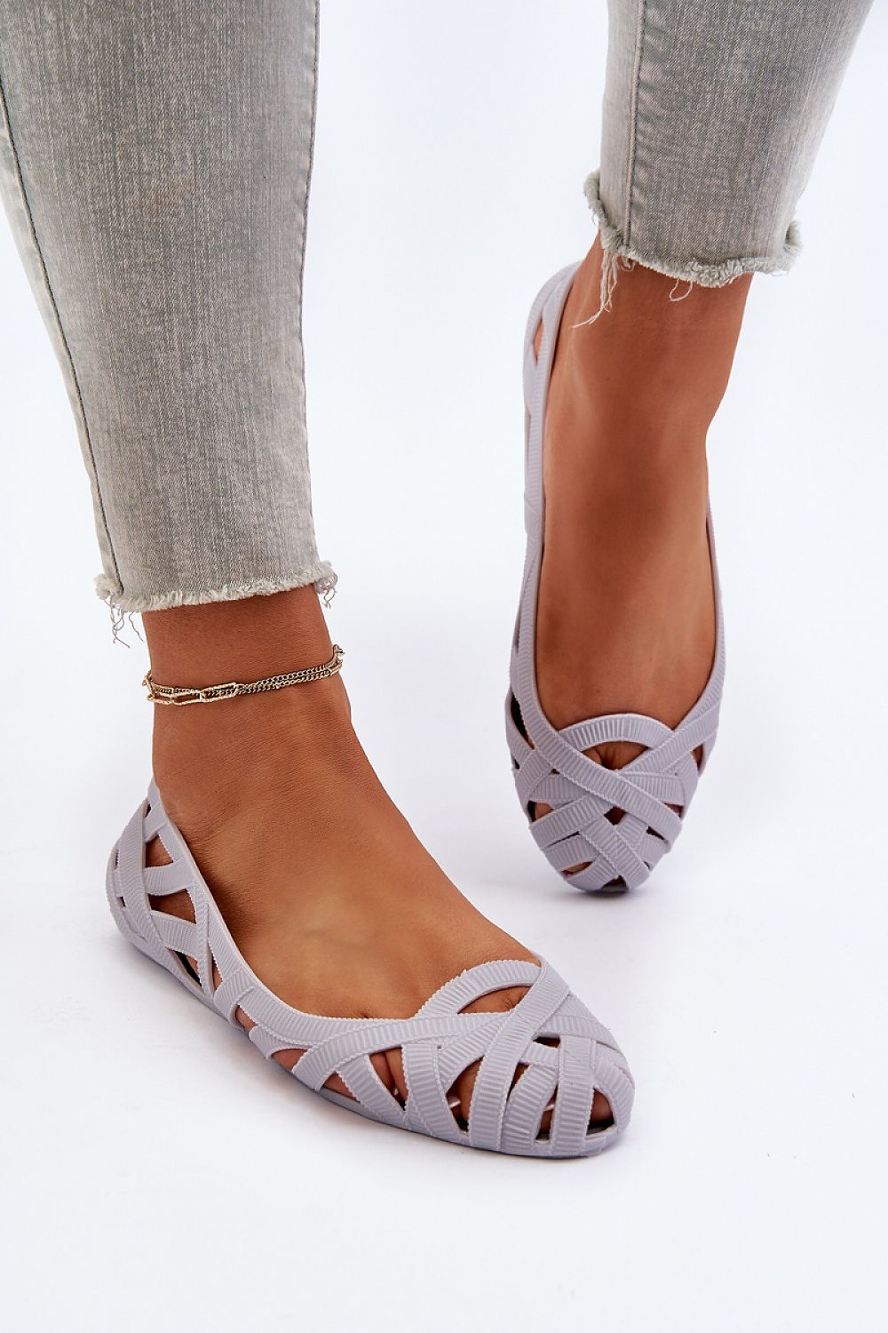 Elegant women's rubber ballerina flats from Step in Style, showcasing an almond-shaped nose and stylish intertwining stripe details.