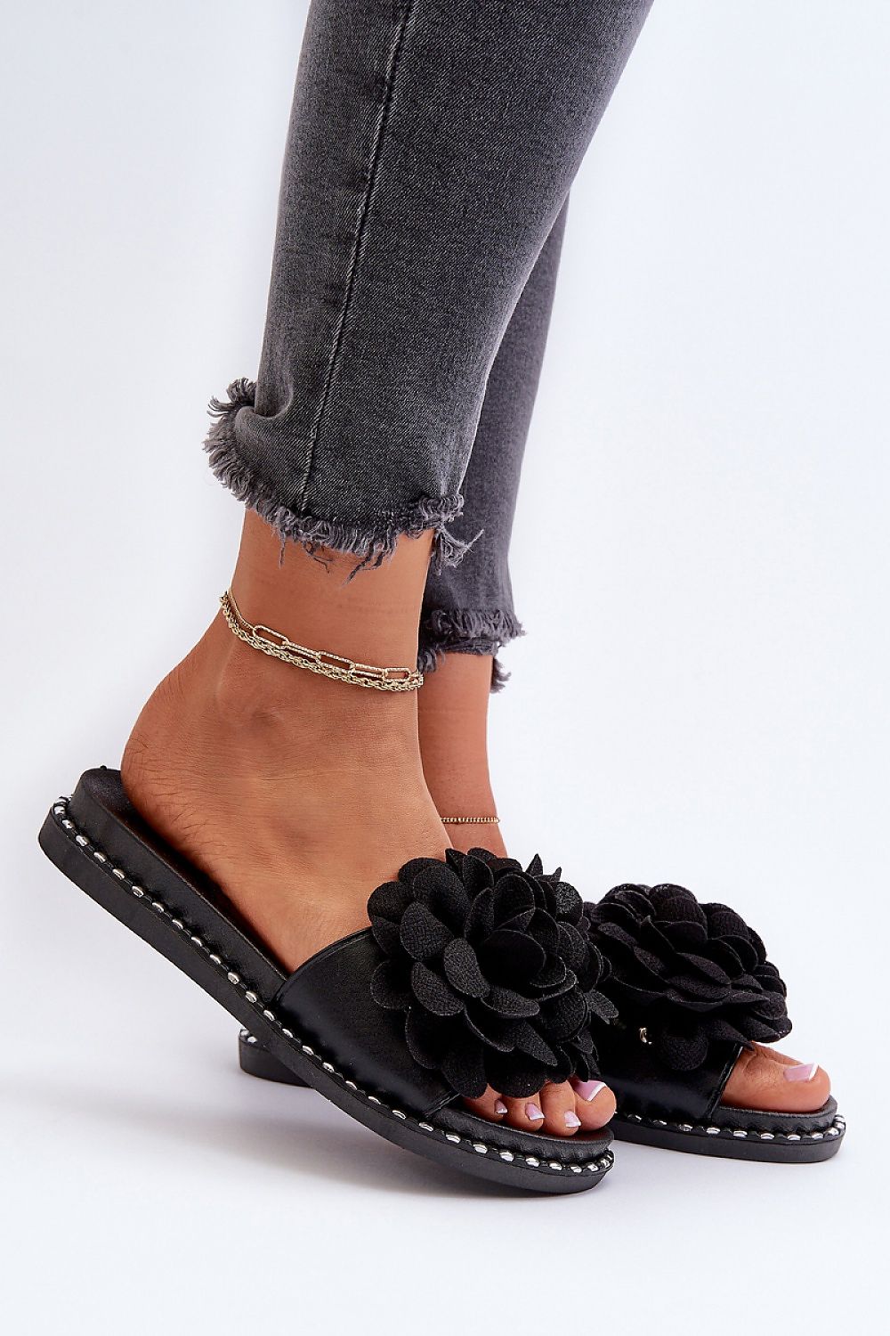 Stylish and chic women's flip-flops from Step in Style, designed with a striking decorative element and durable rubber sole.