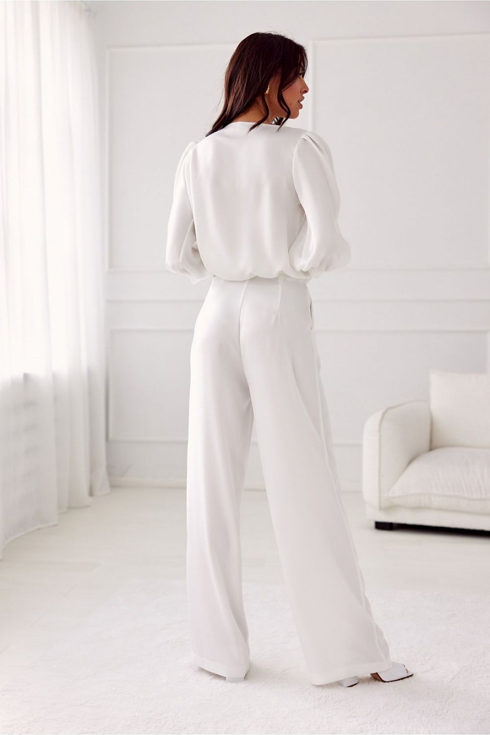 Model wearing Roco Fashion Elsa wide-leg trousers styled for an evening outing, highlighting the sophisticated look.