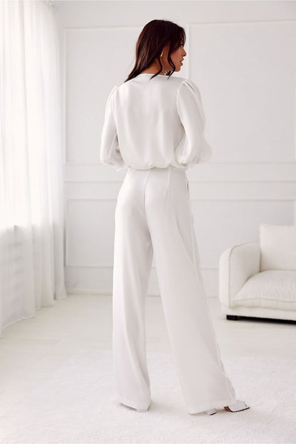 Model wearing Roco Fashion Elsa wide-leg trousers styled for an evening outing, highlighting the sophisticated look.