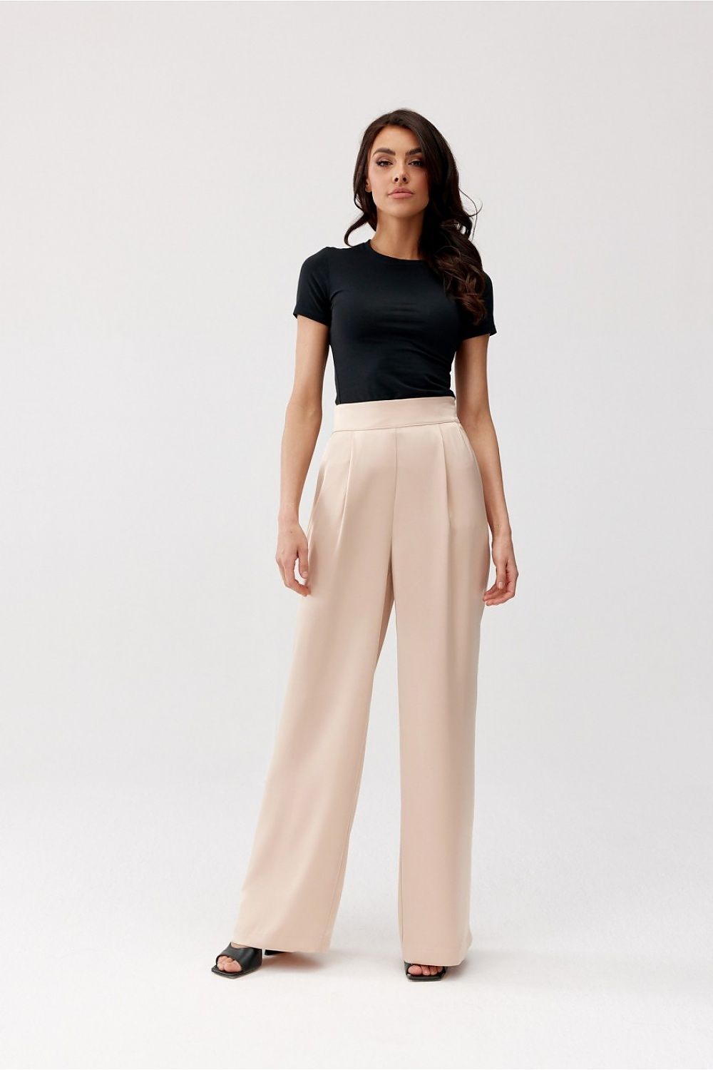Chic Roco Fashion Elsa Wide-Leg Trousers elegantly paired with a fitted blouse, perfect for upscale events.