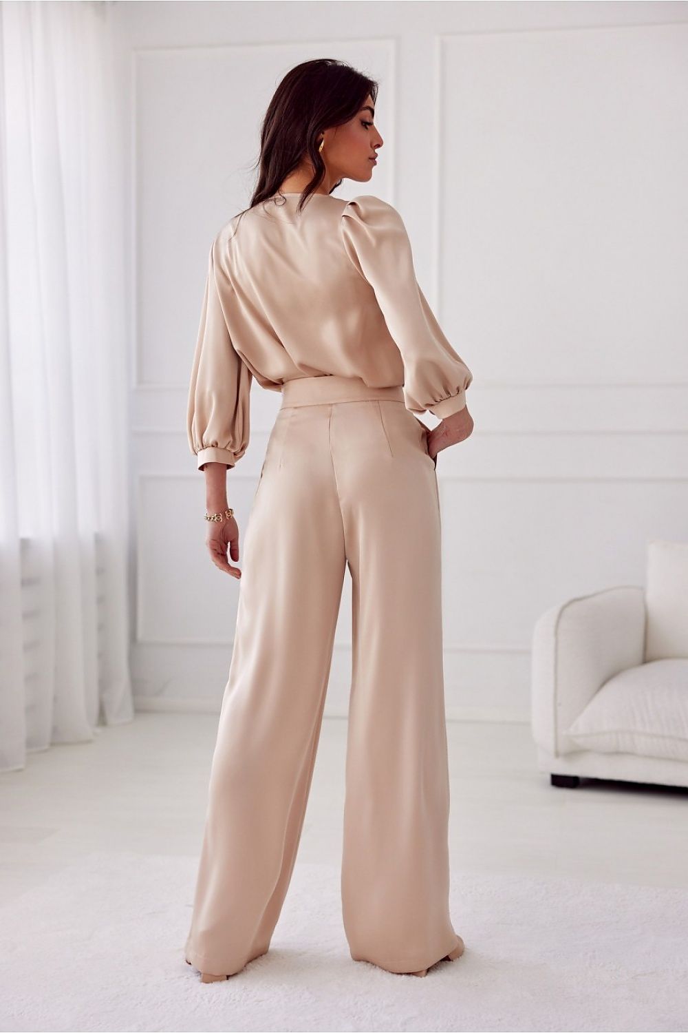 Versatile Roco Fashion Elsa Trousers tailored for elegant occasions, featuring a sophisticated satin finish and practical side pockets.