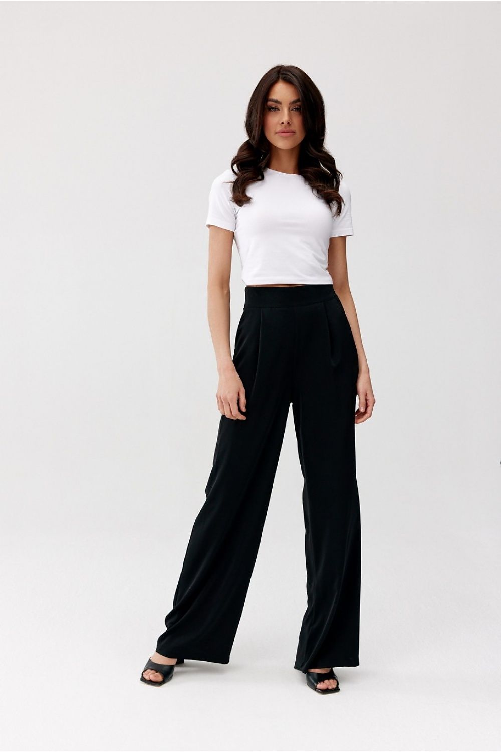 Stylish Alaya trousers by Roco Fashion, displayed in a sophisticated setting, emphasising the loose wide leg design and flattering high waist.