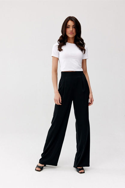 Stylish Alaya trousers by Roco Fashion, displayed in a sophisticated setting, emphasising the loose wide leg design and flattering high waist.