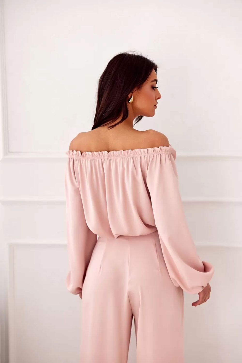 Model wearing the Rosie Satin Blouse by Roco Fashion, featuring a flowy silhouette and stylish long sleeves, ideal for sophisticated outings.