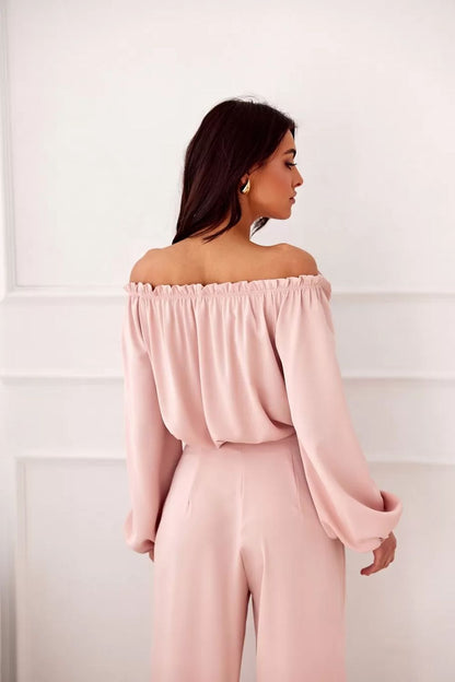 Model wearing the Rosie Satin Blouse by Roco Fashion, featuring a flowy silhouette and stylish long sleeves, ideal for sophisticated outings.