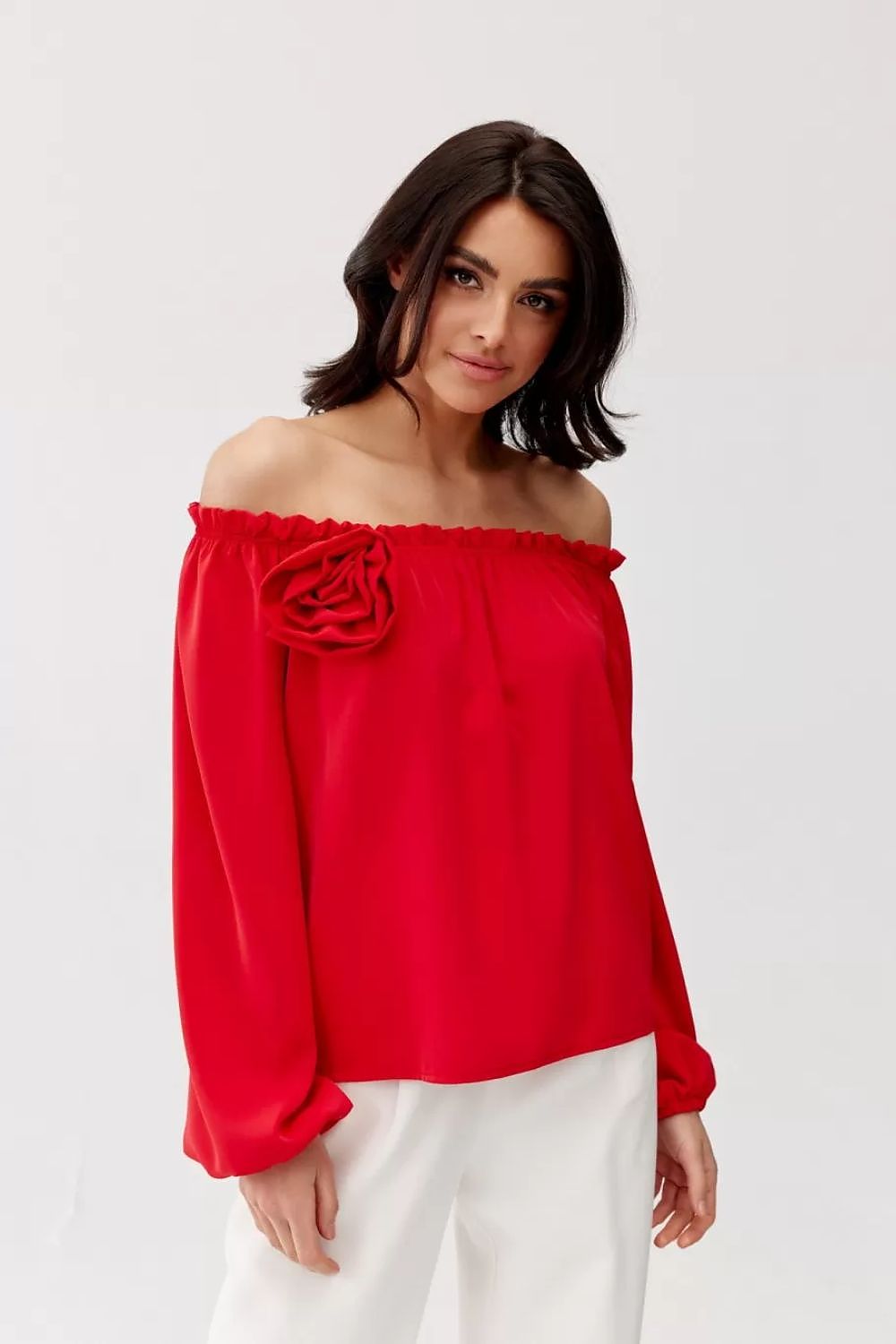 Elegant Rosie Satin Blouse by Roco Fashion displayed on a model, highlighting its flattering Spanish-style neckline and flowy sleeves for sophisticated styling.