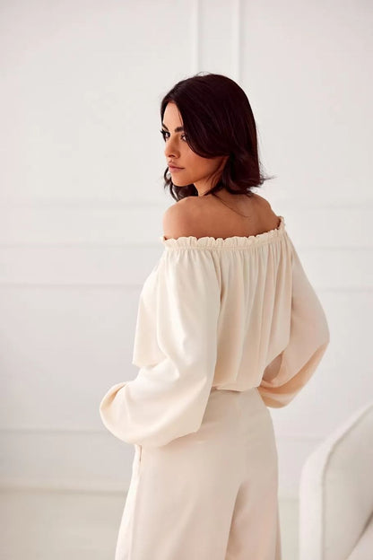 Back view of the Rosie Satin Blouse by Roco Fashion, demonstrating the fitted design and luxurious fabric ideal for special events.