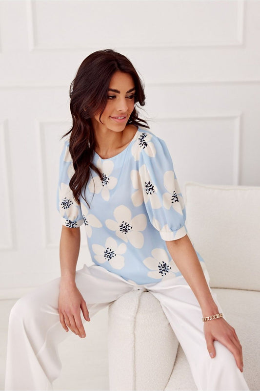 Close-up of the luxurious fabric of Jenna Blouse by Roco Fashion, showcasing its elegant round neckline and comfortable polyester composition.