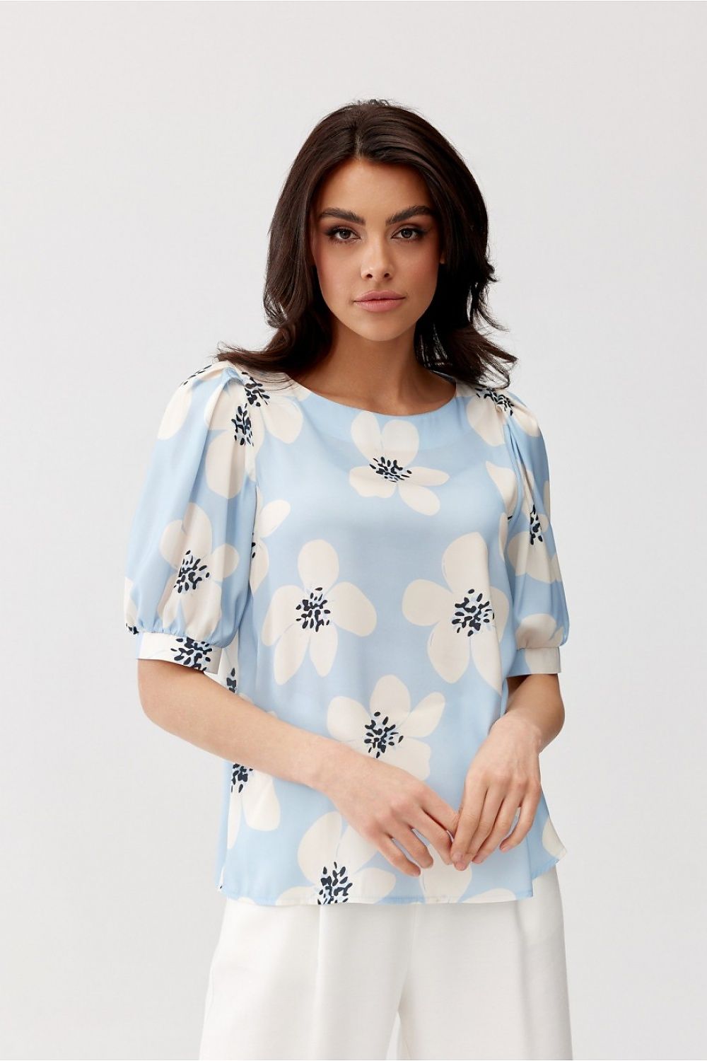 Elegant Jenna Blouse by Roco Fashion featuring unique buffet sleeves and a classic casual cut, beautifully styled with a round neckline for a feminine silhouette.