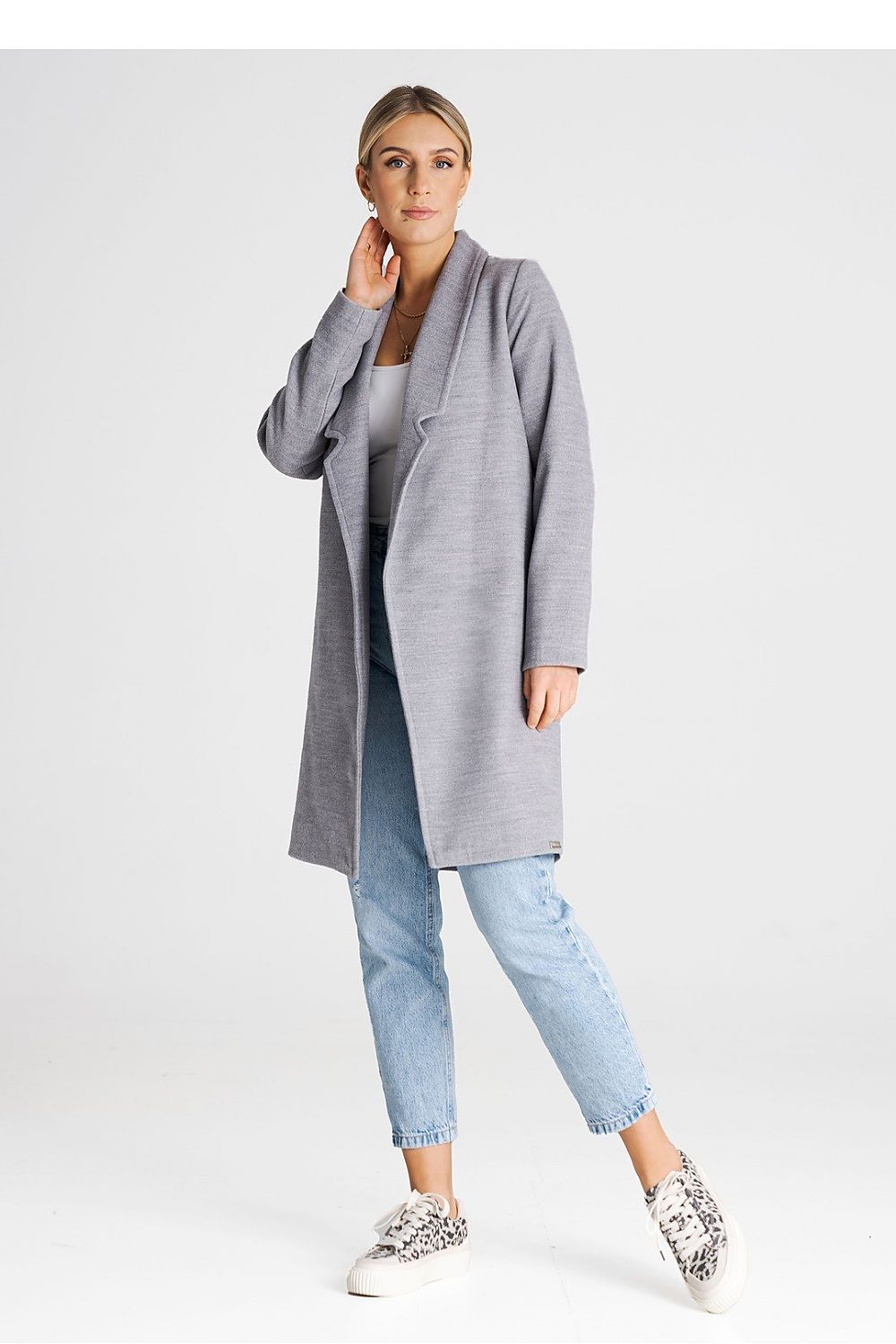 Stylish Figl coat displayed in an effortless unbuttoned look, perfect for chic layering.