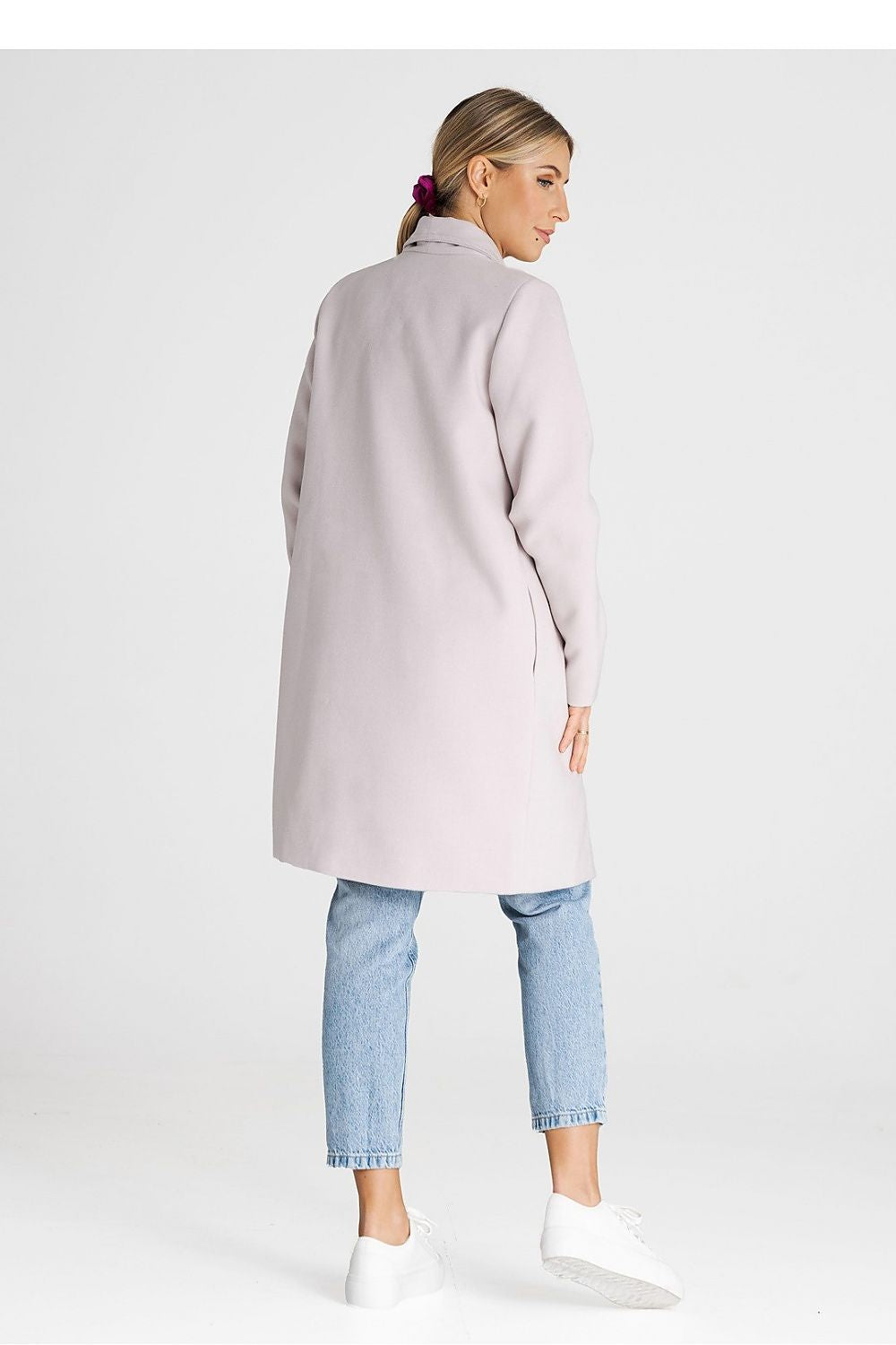 Luxury Figl coat with a large lined collar showcased on a mannequin, highlighting its versatile unbuttoned design.