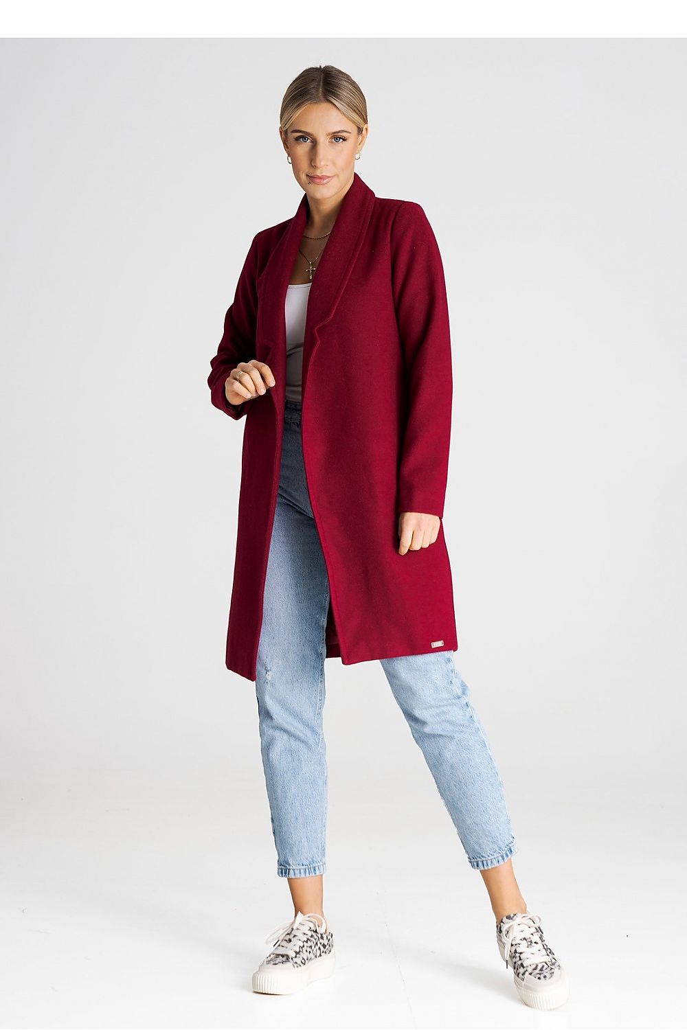 Luxury Figl coat draped elegantly to show off its unbuttoned style and chic collar.