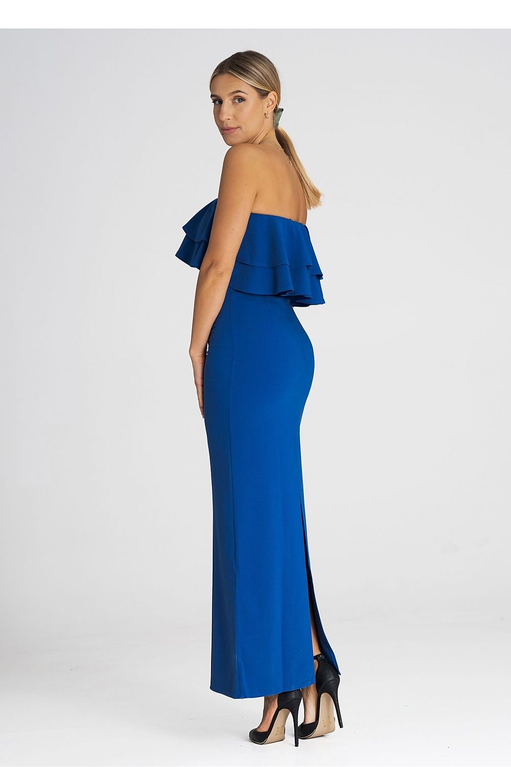 Stylish model wearing the Figl maxi dress with a stunning double ruffle neckline, ideal for formal events and galas.