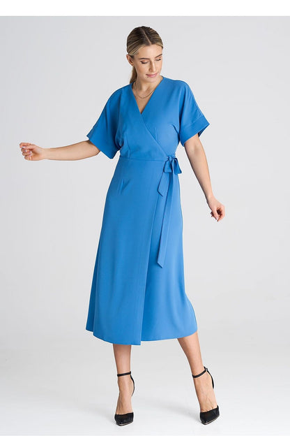 Model wearing Figl Elegant Daydress with kimono sleeves in a chic urban setting, ideal for versatile fashion.