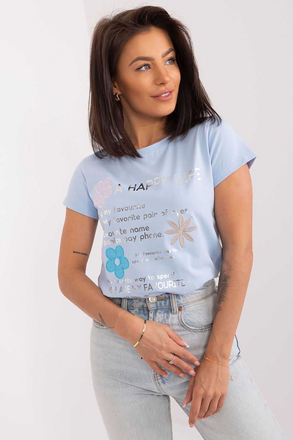 BFG Elegant casual summer blouse featuring decorative lettering and embroidered flowers, perfect for stylish summer outings.