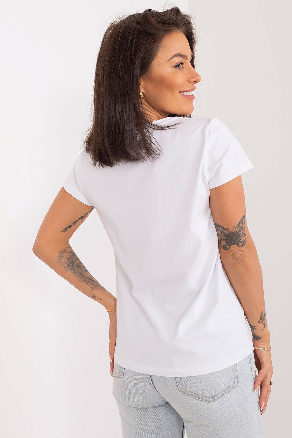 Model wearing BFG summer blouse in a casual setting, showcasing the versatility and comfort of this elegant piece for summer fashion.