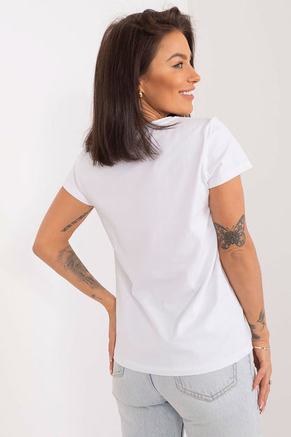 Model wearing BFG summer blouse in a casual setting, showcasing the versatility and comfort of this elegant piece for summer fashion.