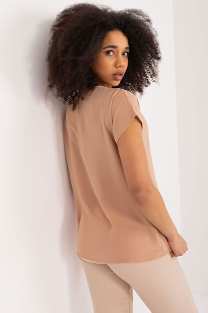 Chic model wearing the BFG luxury casual blouse, accentuating its femininity with a stylish heart neckline, perfect for casual and work settings.